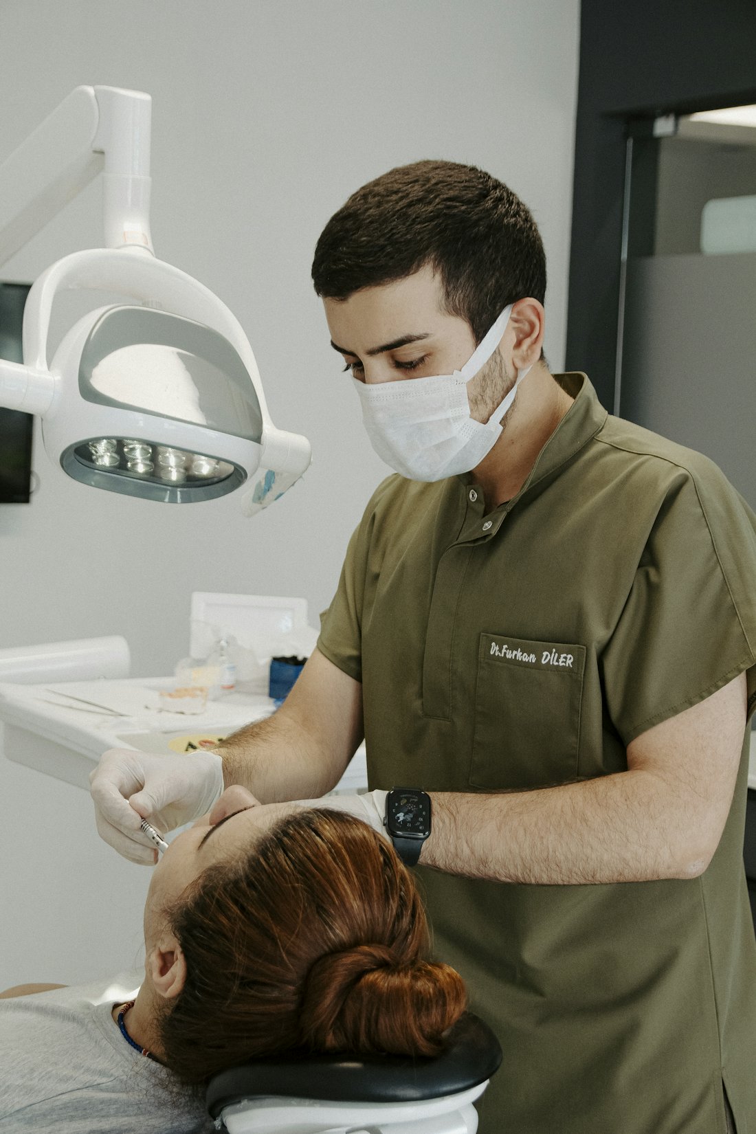 A provider consulting with a patient about clear aligner treatment