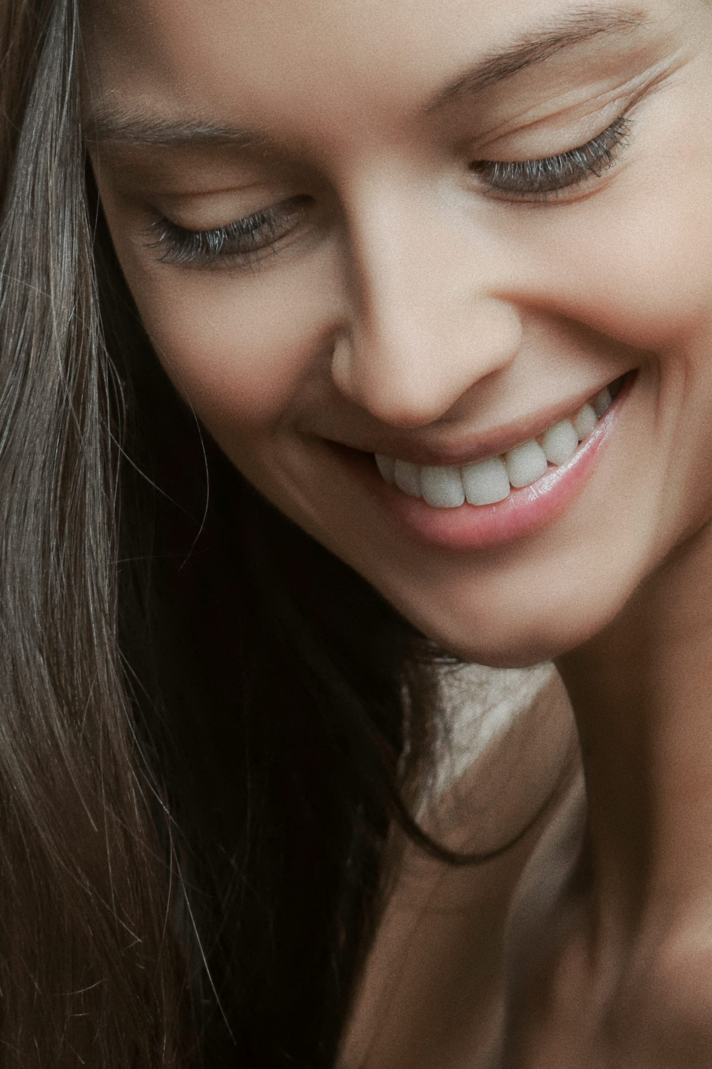 Close-up of a person with a straight, confident smile after clear aligner treatment